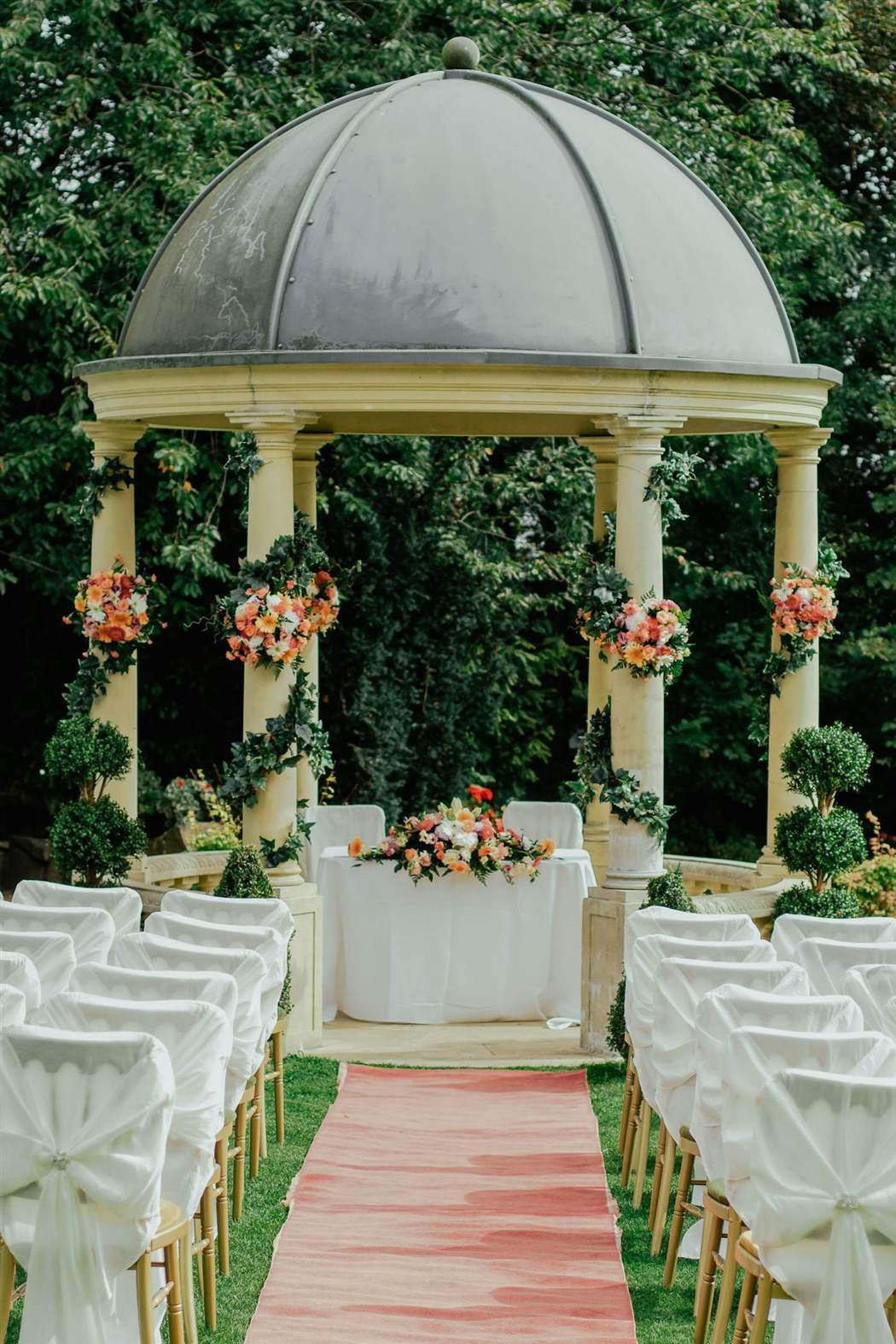 Garden ceremony with floral arch